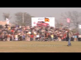 Unusual: Man performs bike stunt at Rural Olympics