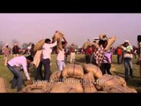Team work in sack lifting competition at Kila Raipur Rural Olympics