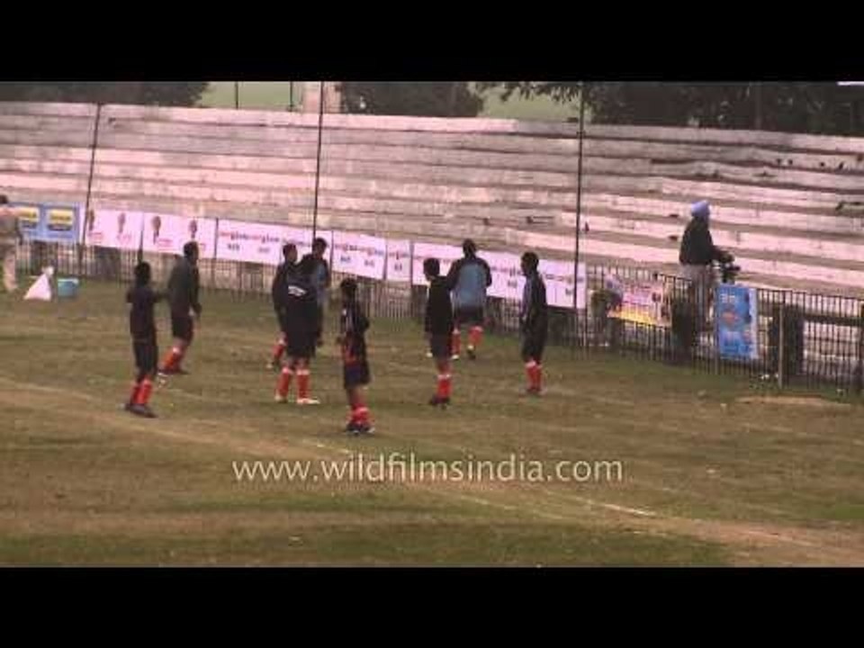 Hockey players warming up before the match : Kila Raipur, Ludhiana