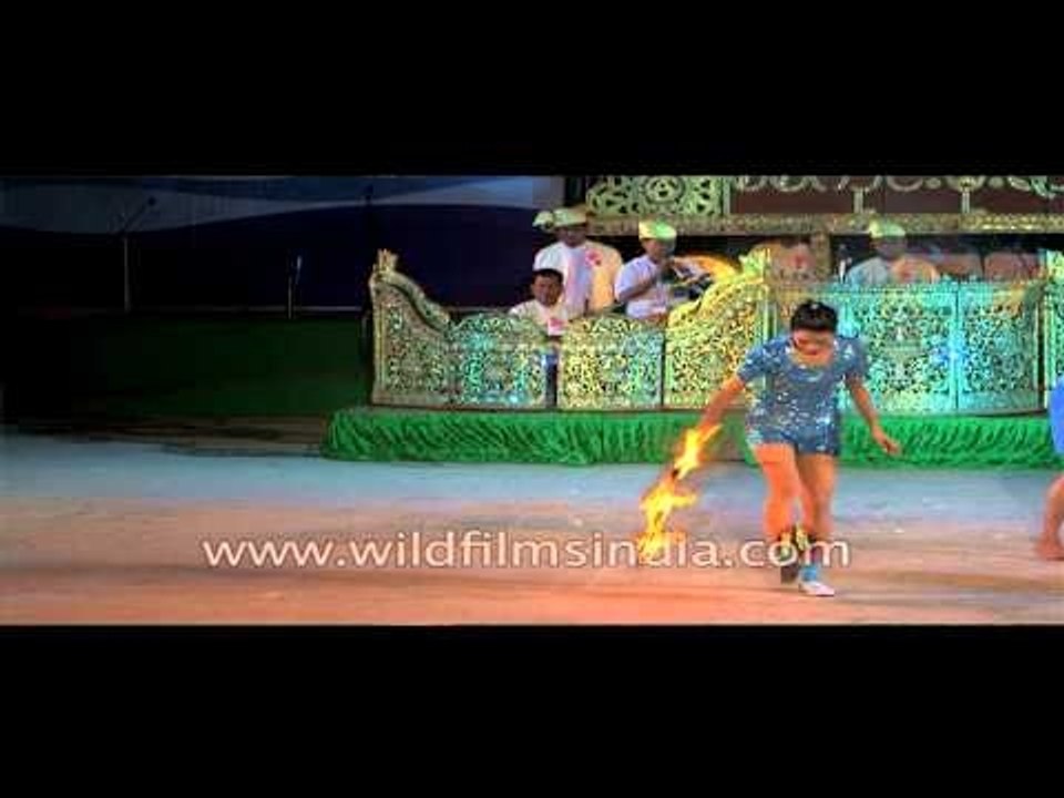 Myanmar women juggling with fire at Sangai festival