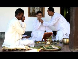 Priest performing puja before Bor Jatra, Manipur wedding