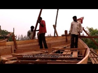 Boat makers arranging the wooden blocks
