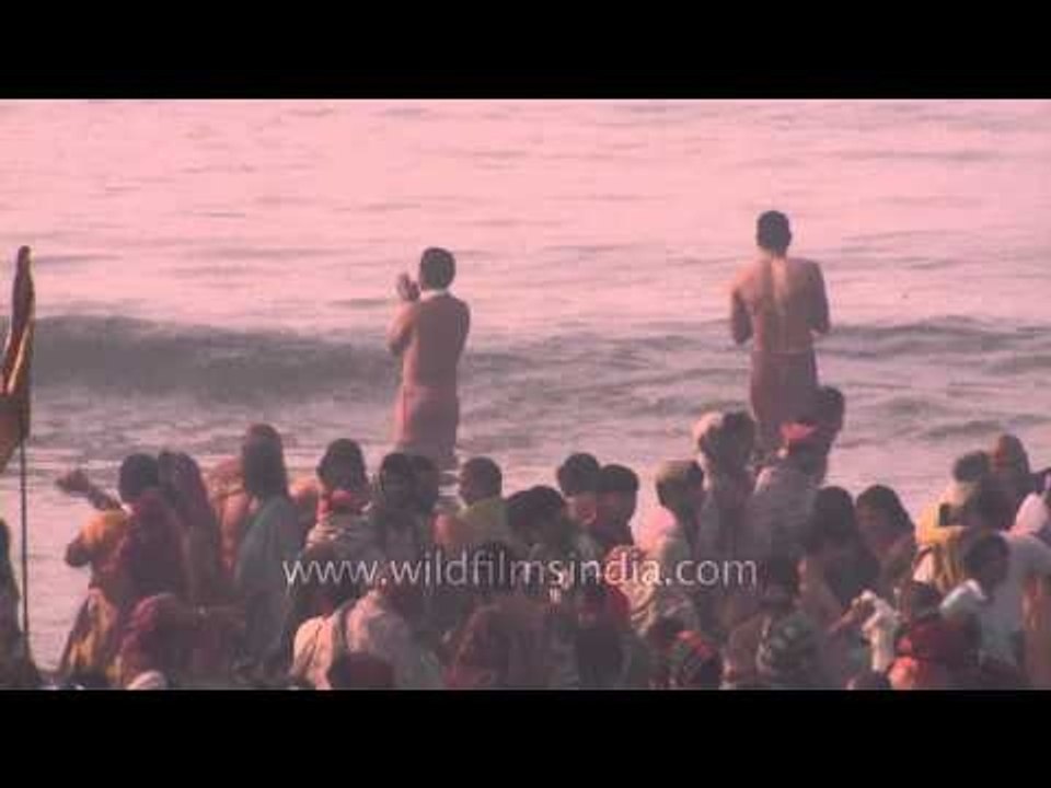 Hindu devotees performing rituals at the banks of ganga : Gangasagar Mela