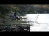 Women fishing with net in Ningthoukhong canal, Manipur