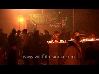 Members of Shia muslim community lighting candles on the day of Chup Tazia