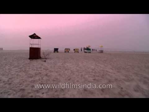 The long sandy beach stretching on the Bay of Bengal