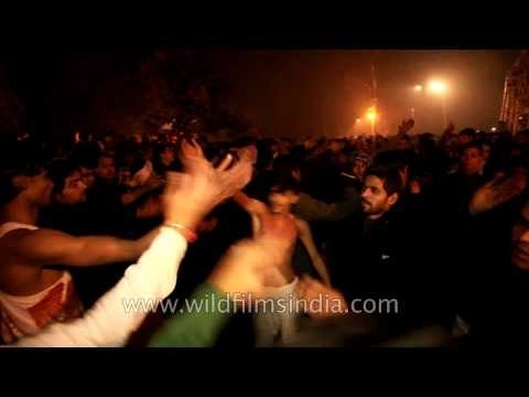 Shia Muslims strike their chests during the procession of Chup Tazia