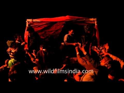 Shia muslims distributing food for free on the day of Chup Tazia