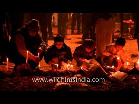 Little devotees lighting candles during Chup Tazia in Delhi