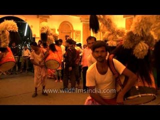 Dhakis beating Dhaks during Aarati, a ritual dance worship on Devi Paksha during Durga Puja