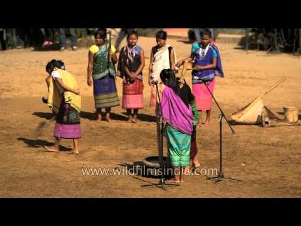 Garo women presenting daily household work at Hornbill Fest