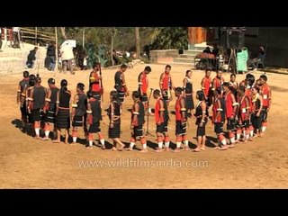 Chakhesang Naga tribe chant and yodel in tribal unison, spears in hand