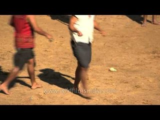 Kuki youth playing the indigenous top spinning game at  Hornbill Fest