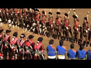 Tribals in ethnic wear awaiting for the chief guest