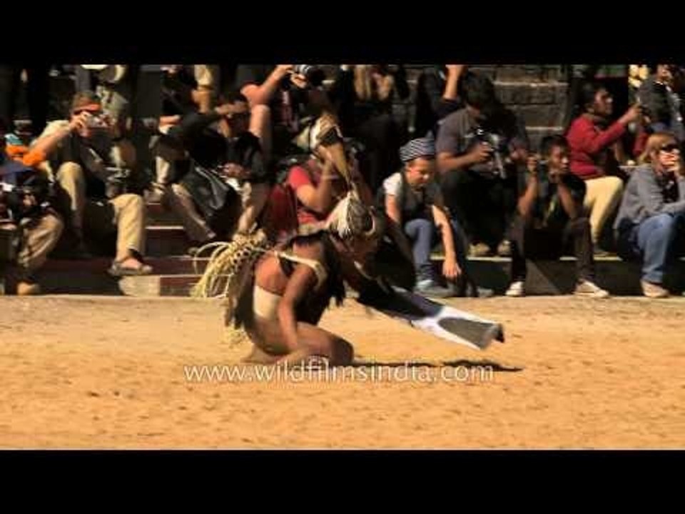 Konyak tribe giving demo of head hunting during Hornbill Fest