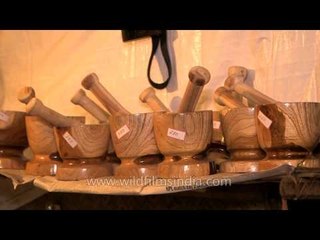 Wooden mortar and pestle for sale at Hornbill Fest