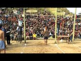 Naga boy takes a high jump to kick the piece of meat at meat-kicking competition