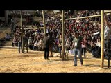 Piece of meat hung in bamboo during meat-kicking competition