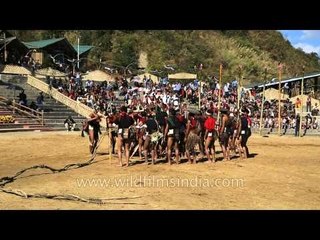 Konyak folks beats the log drum