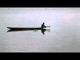 Man riding a traditional canoe boat in Loktak Lake,Manipur