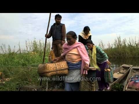 People on boat to nearby city or town for purchase and sale things near Loktak lake