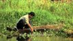 Man using the netting method of fishing in the Loktak Lake, Manipur