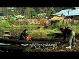 Manipuri family boards a boat on Loktak Lake