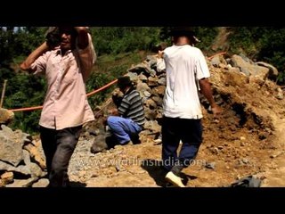 Men working at a construction site on the hills of Mizoram