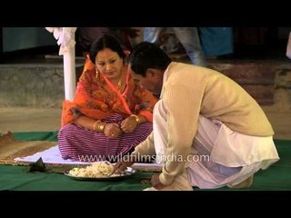 Teaching Manipuri bride how to make Kundo garland