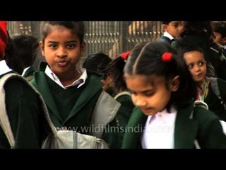 Children waiting for school bus in New Delhi