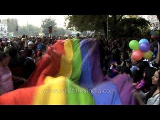 Homosexual holds placards and colourful flag