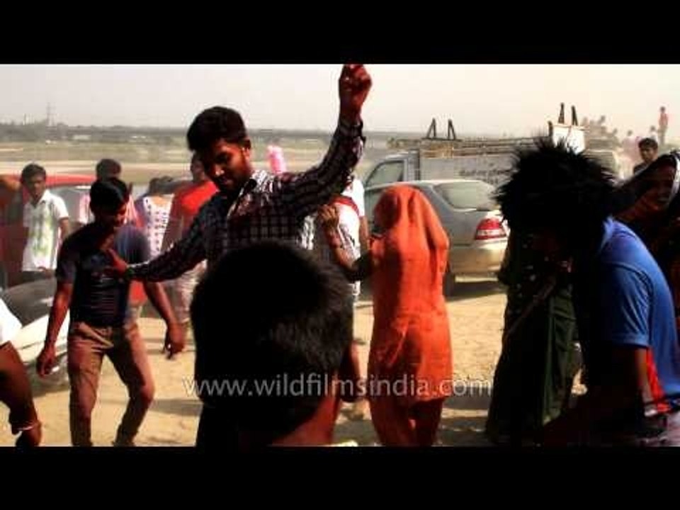 Enthusiastic devotees dancing in full zeal in the procession of Ganesh Festival
