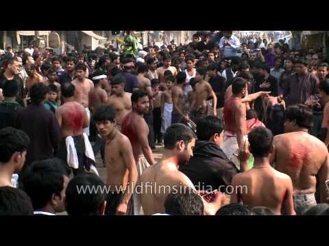 Shia Muslims flagellate themselves at Muharram procession