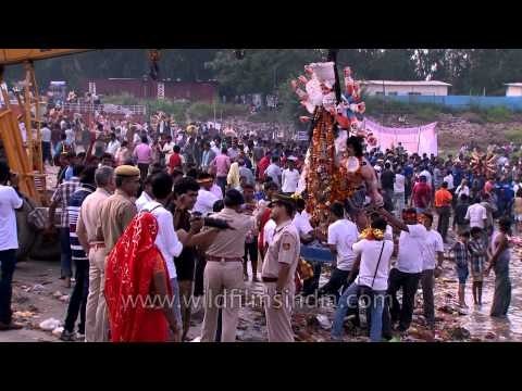 Devotees carrying the Durga Idol for immersion in the river Yamuna