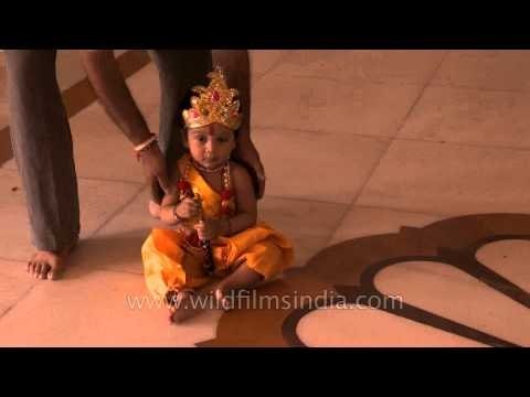 Cute baby dressed as Krishna at Birla Mandir on Janmashtami
