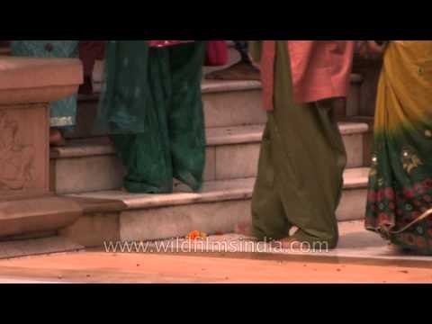 Worshippers walking bare foot inside the Brla Mandir on Janmashtami