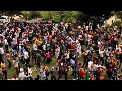 Blood offering to the Goddess by throwing stones on each other of two groups