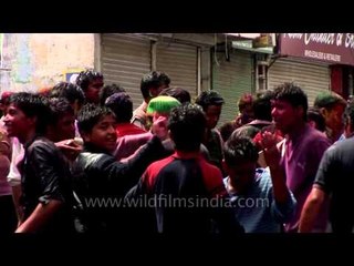 People dancing on Bollywood numbers during Holy celebration