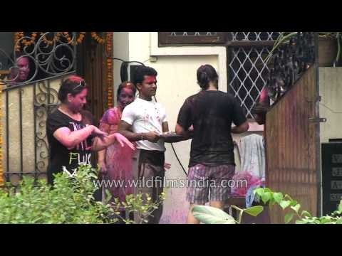 Indian family celebrating the festival of colour, Holi !
