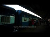 Passengers boarding a train at New Delhi Railway Station