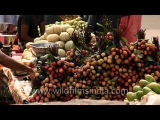 Litchis and kharbuzas being sold near Shastri Nagar metro station
