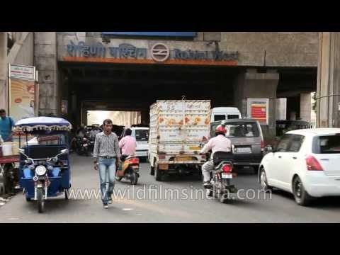 Traffic passing by Rohini West Metro Station