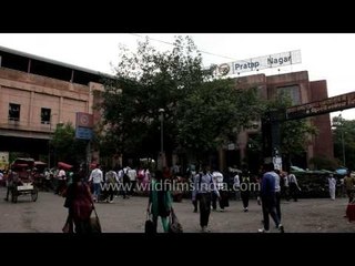 Rickshaws line-up outside Pratap Nagar Metro Station