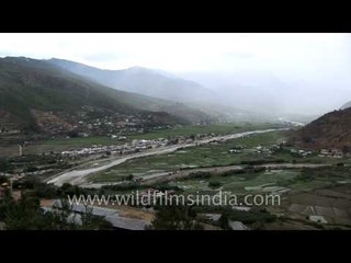 Wide establishing shot of Paro valley with airport, Bhutan