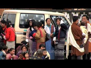 Devotees witnessing the occasion seeking blessings before the Thangka