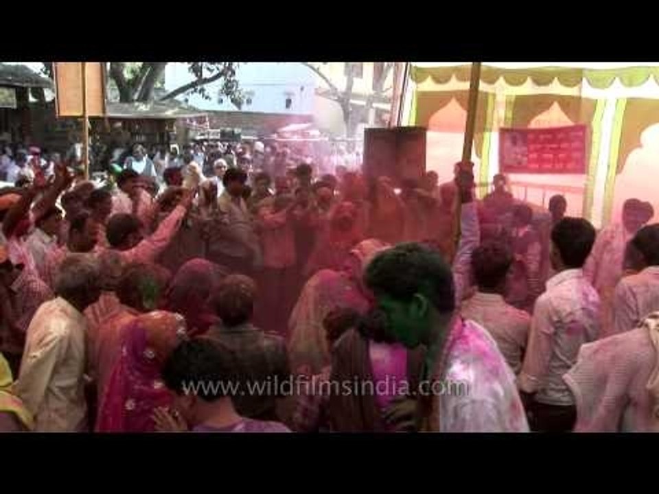 Men wear womens' clothes and dance on the streets