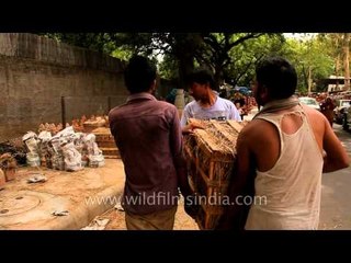 Unloading pottery products in Sarojini Nagar Market