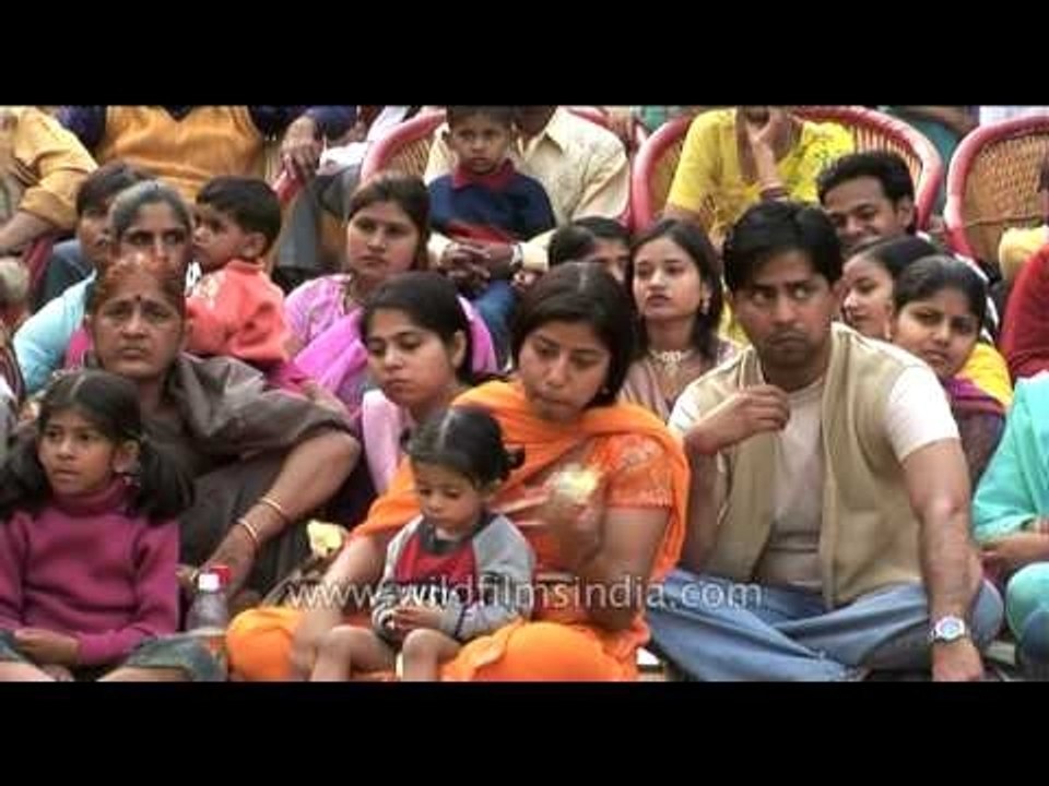 Visitors enjoying the performances at Surajkund mela