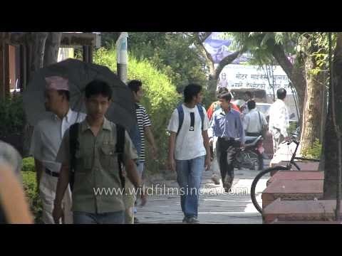 People passing through the pavement in the streets of Kathmandu