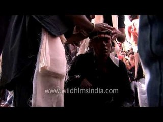 Mourners severely injured and getting first aid